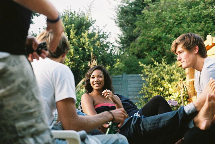 CNV00009 A group of friends hanging out at a garden party